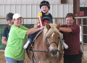 hippotherapy certification client laughing on horse